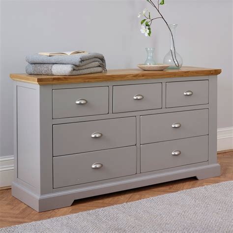 While most bedroom dressers and chests are made from wood, a plastic storage dresser is a great way to keep closets organized. St Ives 3+4 Grey Chest of Drawers with Brushed Oak Top