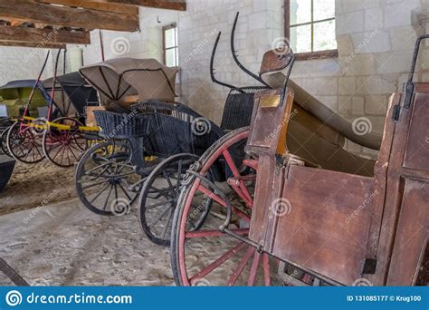 Vintage Carriages On Display In The Stable Of Medieval Castle In France