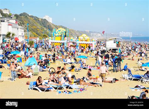 People Sunbathing At Crowded Bournemouth Beach Dorset Uk Stock Photo