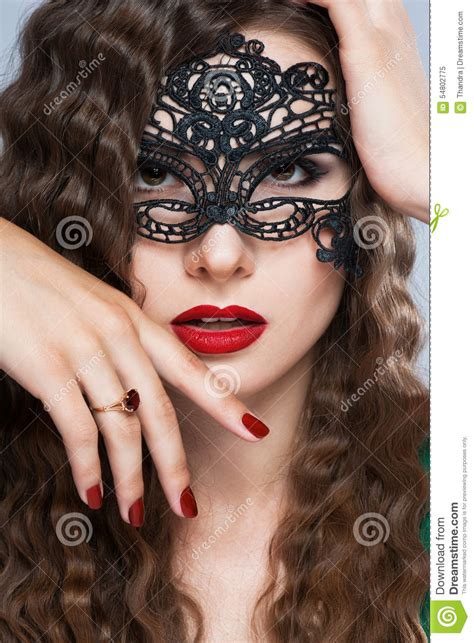 Beauty Model Woman Wearing Venetian Masquerade Carnival Mask At Party Over Holiday Stock Image