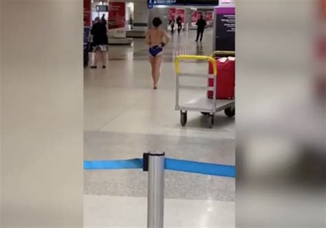 Watch Woman Strips And Sings At Airport