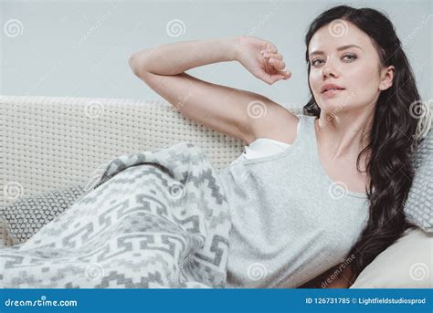 Attractive Young Woman Stretching While Lying On Sofa Stock Image Image Of Couch