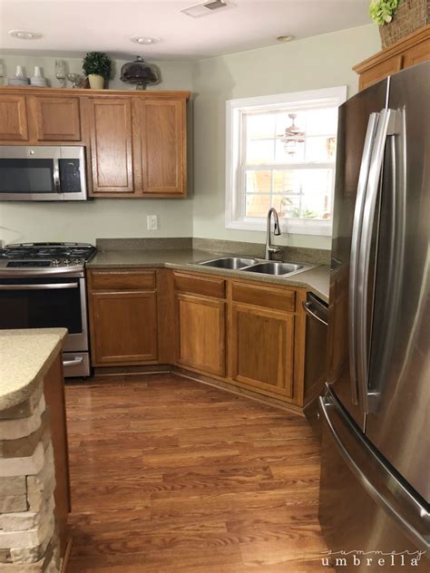 *squints* nope, not a piece a sandpaper in sight! How to Paint Kitchen Cabinets Without Sanding | LZ Cathcart