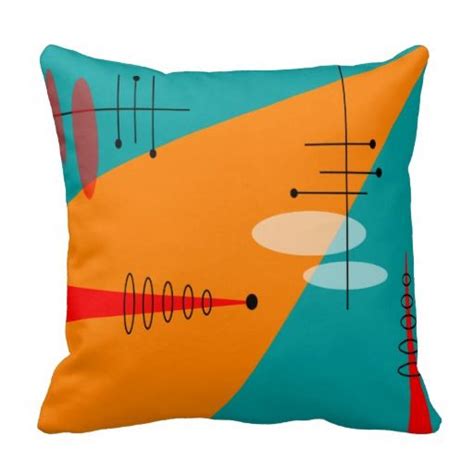 A Pillow With An Abstract Design On The Front And Back In Orange