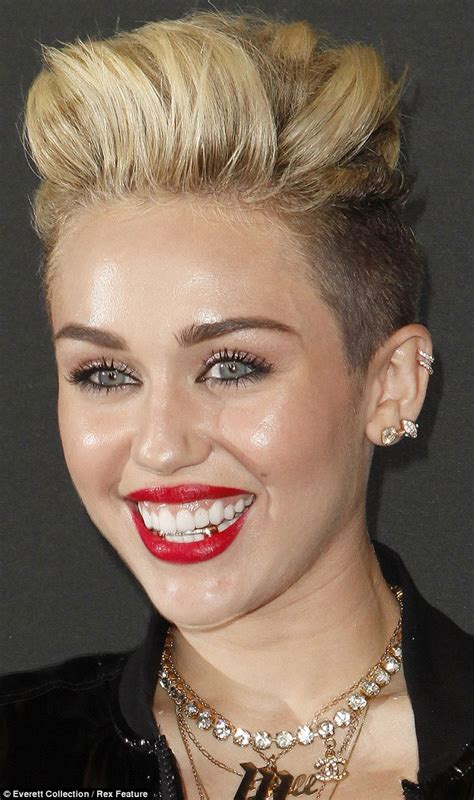 Miley Cyrus Continues Her Gangsta Transformation With A Gaudy Gold