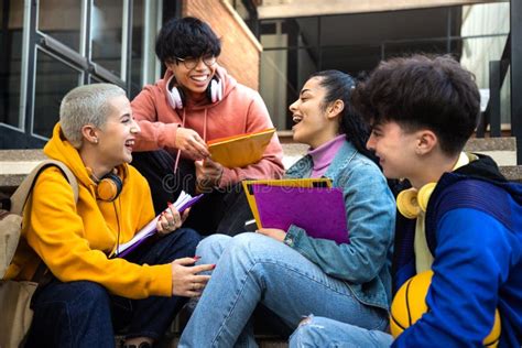 Multiracial Group Of Gen Z College Students Talk And Laugh Sitting On