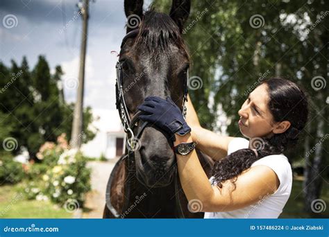 A Woman And A Horse At The Stud Horse Riding Stock Photo Image Of