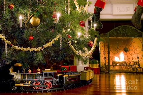 Toy Train Under The Christmas Tree Photograph By Diane Diederich