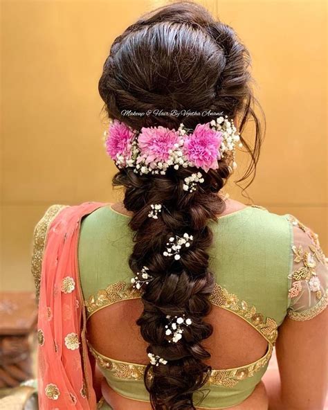 gorgeous romantic bridal hairstyle by mua vejetha anand for swank braids with fresh flowers