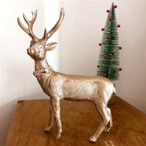 Add to favorites 4 pcs mini white reindeer plastic teeny tiny deer diaramas, globes, scenes. Gold Reindeer Christmas Table Decorations By Bunting ...