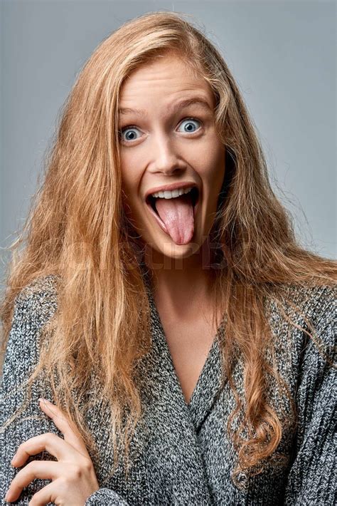 Woman Playfully Sticking Her Tongue Out Stock Image Colourbox