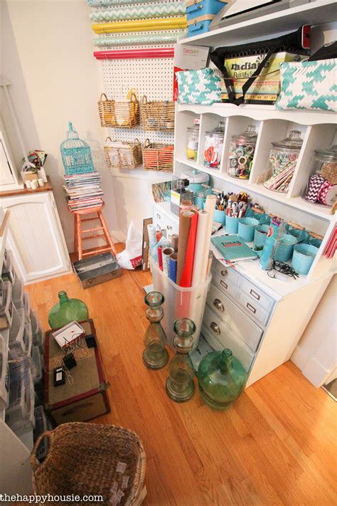 For instance, this room by ursula carmona of home made by carmona uses basic wooden dowels to organize supplies such as string, twine, and ribbon. How to Organize a Craft Room Work Space - The Happy Housie