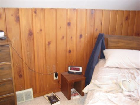 I have the same knotty pine wood walls in my house. Remodelaholic | Painting Over Knotty Pine Paneling ...