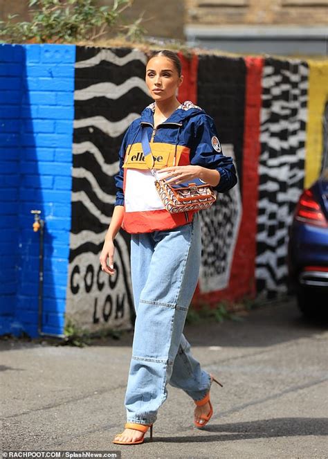 Olivia Culpo Flashes Her Abs In Tiny Crop Top During Photo Shoot For Michael Kors In London