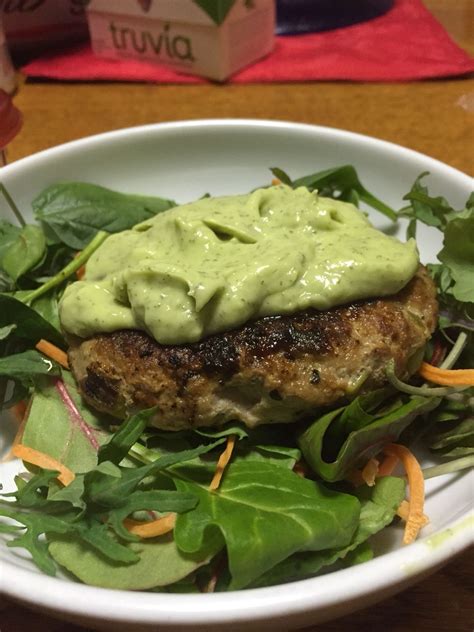 Homemade Turkey Burger With Avocado Ranch Dressing Over Mixed Greens