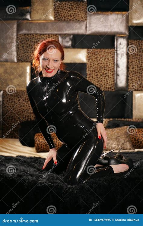 Strong Real Bdsm Adult Mistress Wearing Fetish Latex Rubber Catsuit And