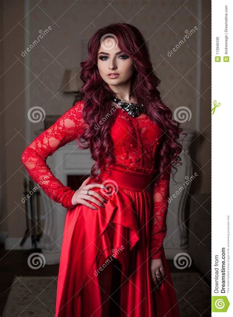 Redheaded Girl In A Red Dress In The Interior Stock Image Image Of