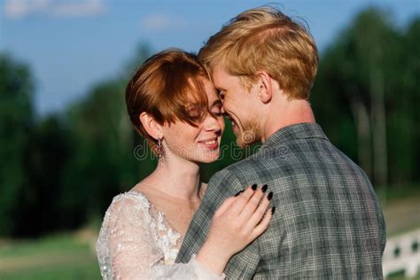 Nice Redhead Young Just Married Happy Couple Kissing In The Sunset Outdoors Stock Image Image