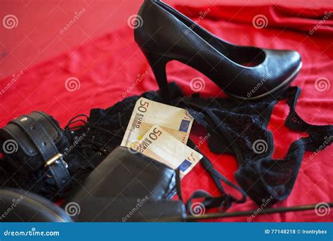 Prostitute Or Striptease Concept 50 Euro Banknot With Sex Toys On Red