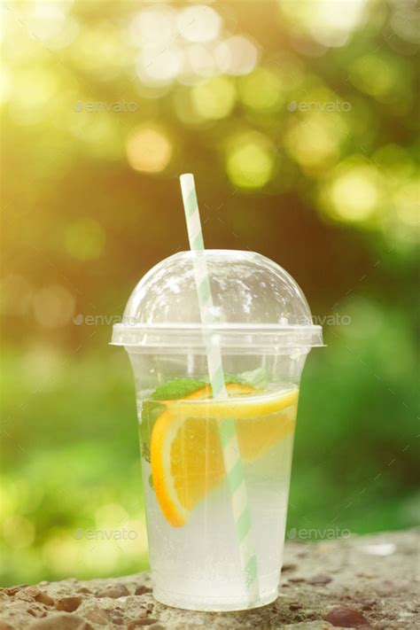 Summer Drink Fresh Lemonade With Orange And Mint In The Plastic Cup