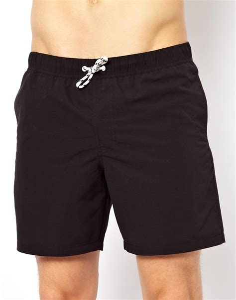 Check out the top men's swim trunks for style and comfort during the warm weather season. Lyst - Asos Swim Shorts In Mid Length in Black for Men