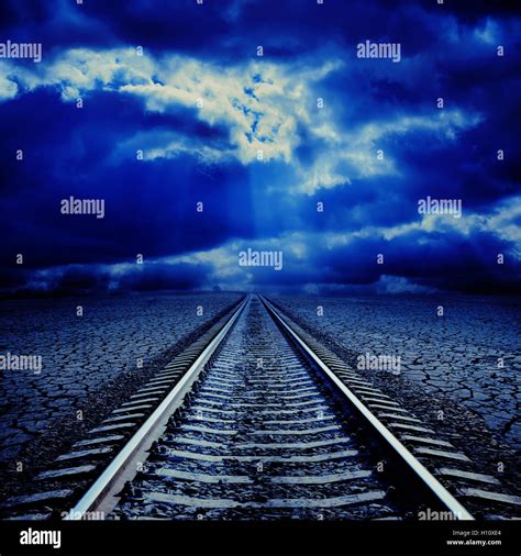 Railroad In Night To Cloudy Horizon Stock Photo Alamy