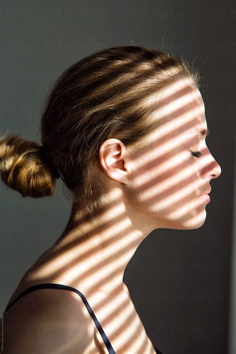 Woman With Shadow Lines On Face By Stocksy Contributor Danil Nevsky Stocksy