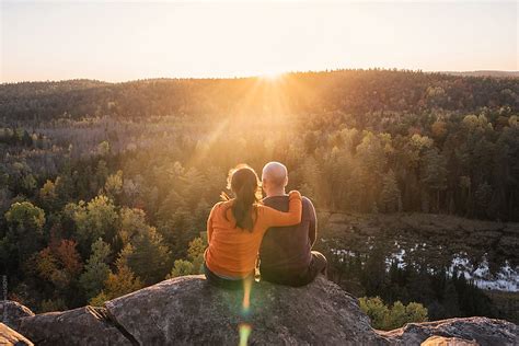 Couple Enjoying Beautiful Sunset View On Mountain By Stocksy