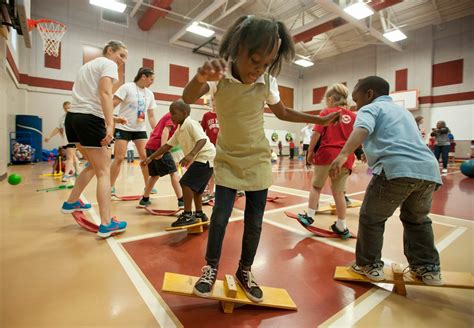 Tufts University Softball Team Volunteers At Elementary Gym Class