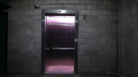 Elevator Door Closes Basement Ground Level Dark Parking Garage Alt
