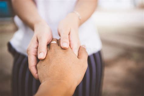 Two People Holding Hands For Comfort Giving A Helping Hand Stock Image