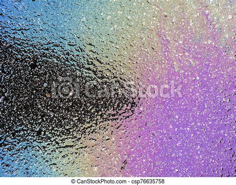 Multi Colored Oil Spill On Asphalt Road Abstract