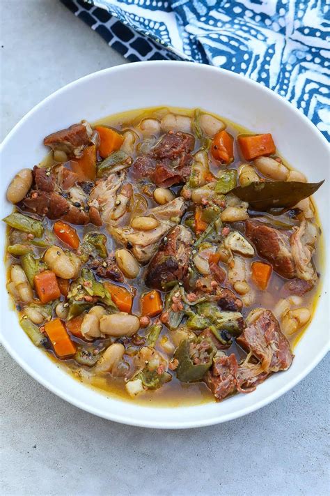 Creamy And Flavorful White Bean Stew With Chunks Of Ham Hocks That Add