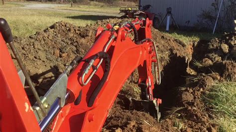 Digging A Ditch With A Compact Tractor And Backhoe Youtube