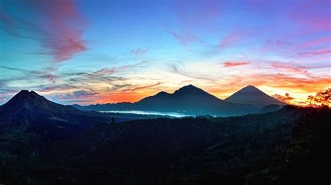 Download Wallpaper 1366x768 Mountains Sky Bali Sunrise