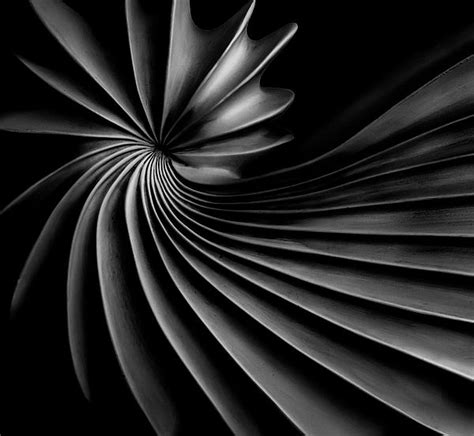 A Black And White Photo With An Abstract Swirl Design In The Center