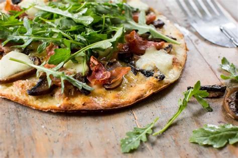 Garlic Mushroom And Prosciutto Pizza With Rocket And Truffle Oil