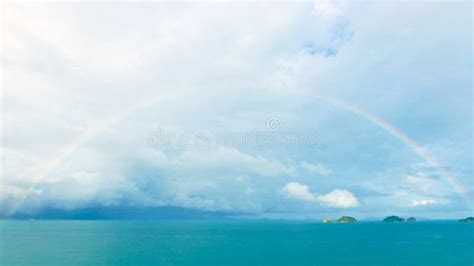 Rainbow On Sky Sea Ocean After Raining Cloudy Day Panorama Stock