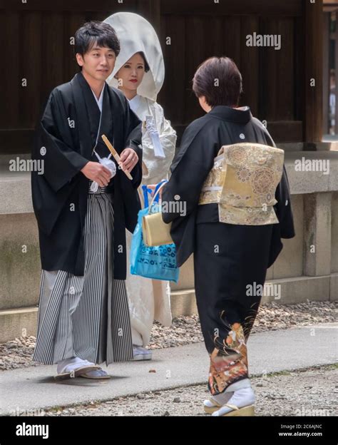 Japanese Bride And Groom In Traditional Kimono At Meiji Jingu Shinto
