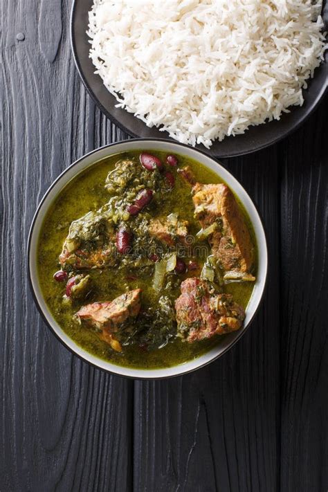 ghormeh sabzi persian herb stew with meat and beans closeup in a bowl vertical top view stock