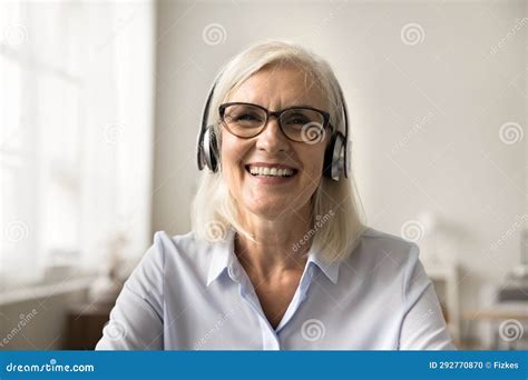 Happy Pretty Blonde Older Business Woman Speaking On Online Conference