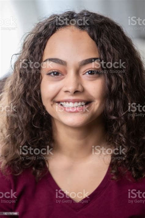 Portrait Of Confident Young Female Looking At The Camera Stock Photo