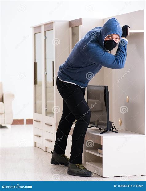 Man Burglar Stealing Tv Set From House Stock Photo Image Of Balaclava