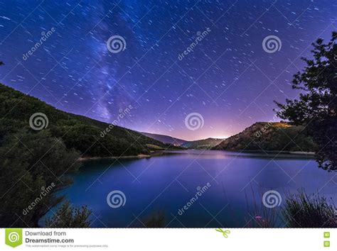 Purple Night Sky Stars Lake Landscape With Milky Way On Mountain Stock