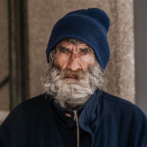 Free Photo Front View Of Homeless Man With A Beard Outdoors