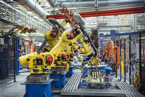 Robots With Car Parts In Car Factory Invest In France