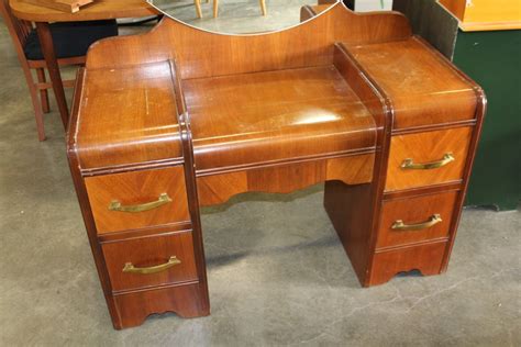 Measures l 50.25 x w 17.5 x h 28, the mirror height is 39. VINTAGE WALNUT WATERFALL VANITY DRESSER AND MIRROR AND STOOL