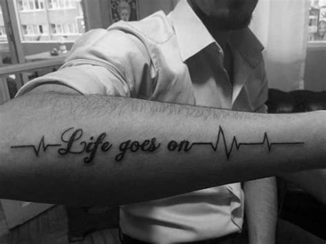 It's an adornment on its own! 40 Life Goes On Tattoo Designs For Men - Phrase Ink Ideas