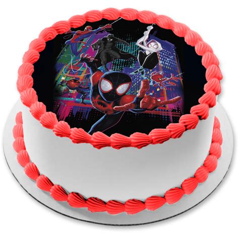A Spider Man Cake With Red Frosting And Decorations On The Top Is Shown