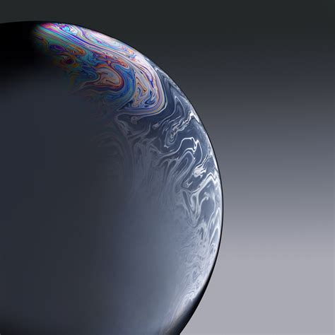 The wallpapers sort of look like planets or marbles modeled and textured in 3d by the early 1990s software rendering application bryce creator, . Download the iPhone XR wallpapers here Gallery - 9to5Mac